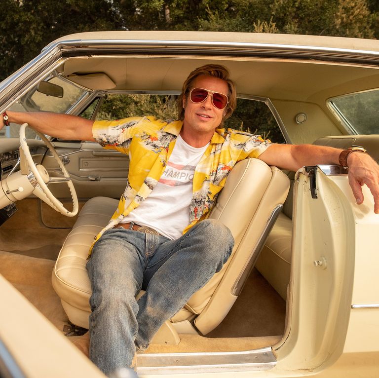 Cliff Booth in Once Upon A Time In Hollywood sits in his Cadillac with his Hawaiian shirt and leather watchband by Red Monkey
