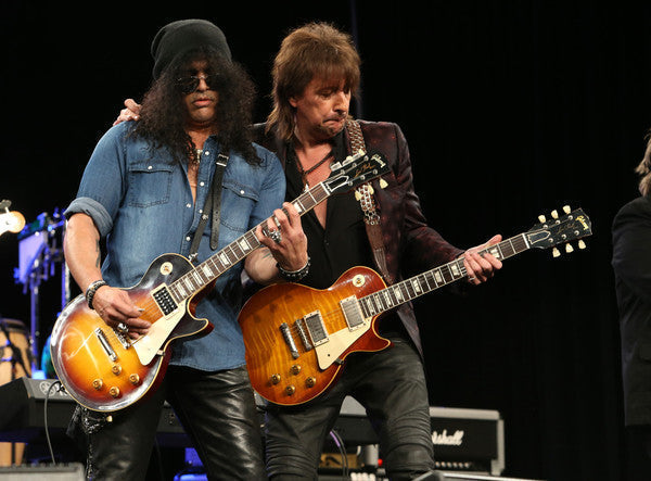 Slash and Richie Sambora performing with Les Paul guitars and Red Monkey leather guitar straps