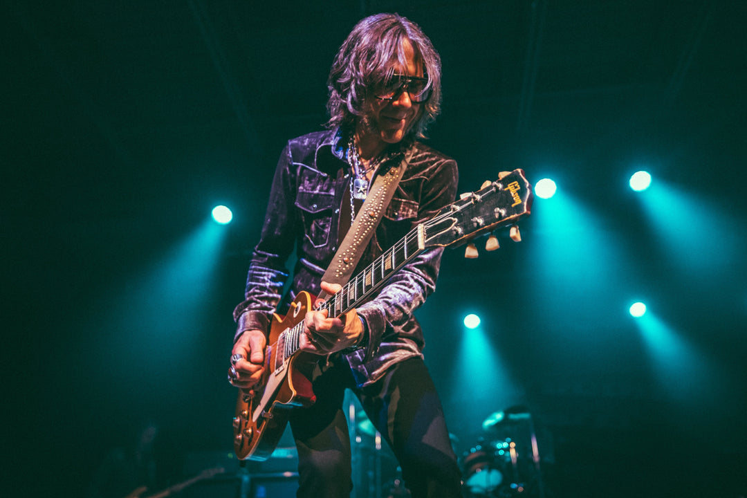 Charlie Starr of Blackberry Smoke performing with a Red Monkey Ace of Spades guitar strap and Gibson Les Paul