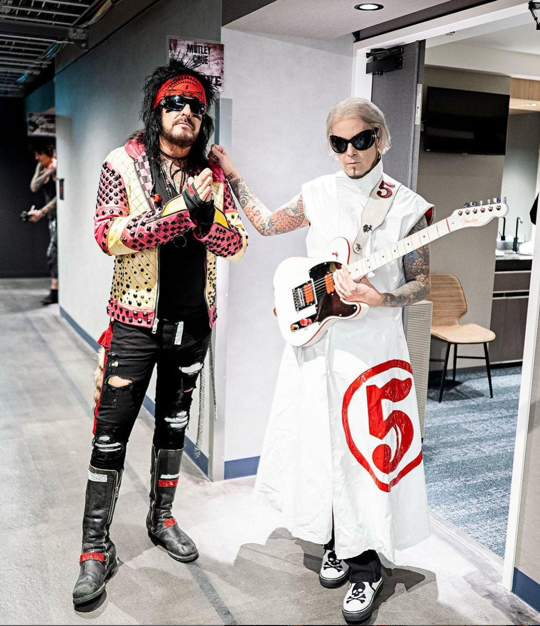 <img alt="John 5 performing with a custom Red Monkey Designs leather guitar strap" src="...">