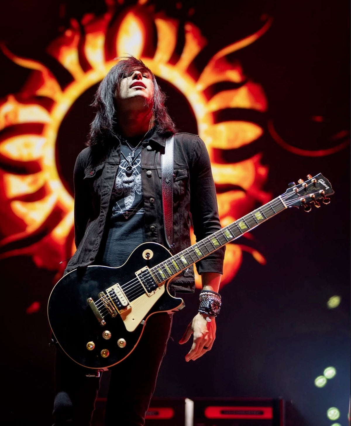 Sam Koltun of Godsmack performing with a Gibson Les Paul and Red Monkey leather guitar strap