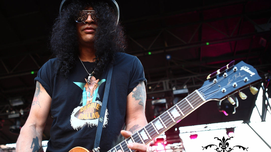 Slash performing at the Sunset Strip Music Festival on August 28, 2010, wearing a custom Red Monkey Slasher guitar strap with a one-of-a-kind sterling silver Monkey emblem.