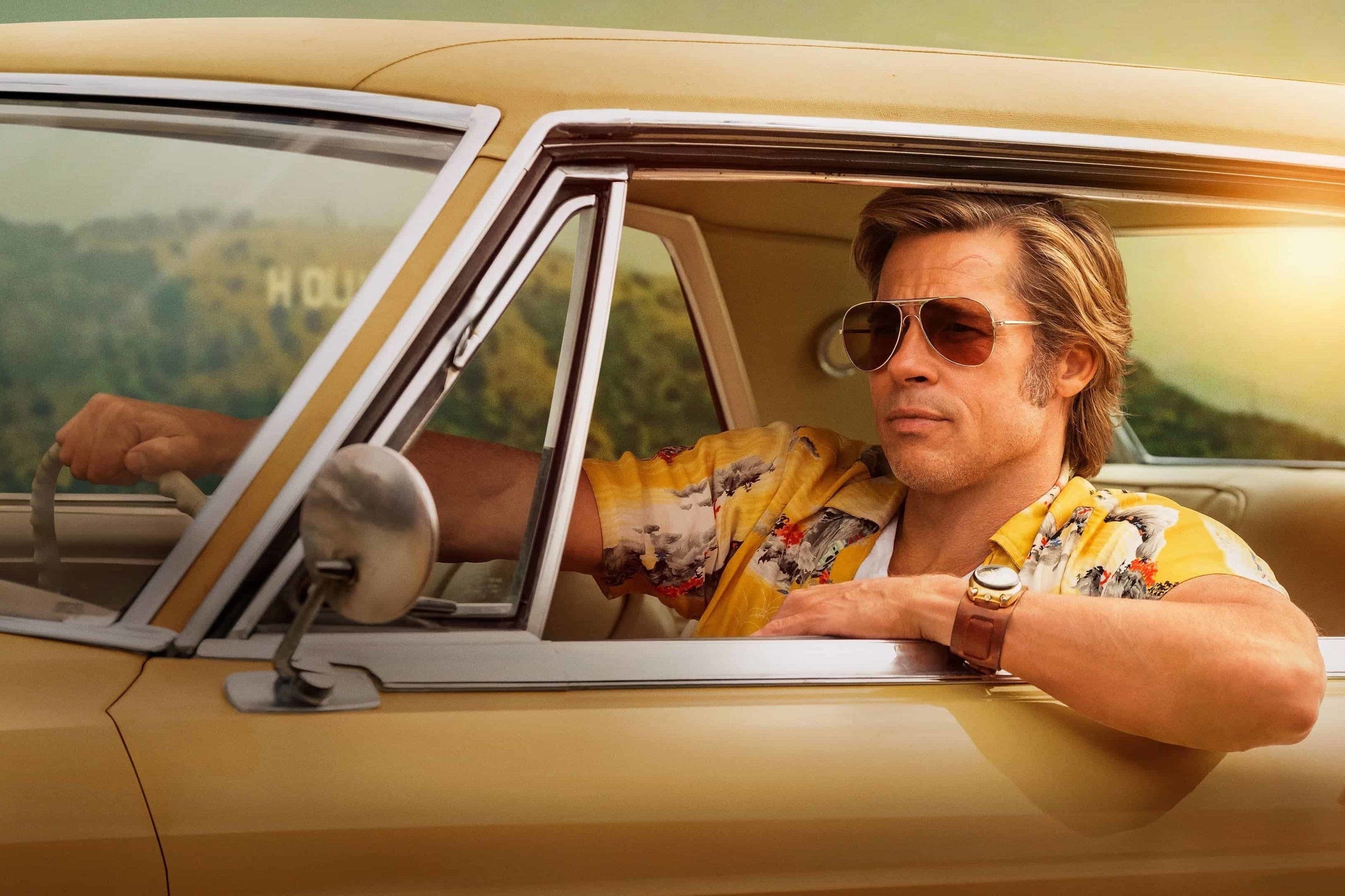 Brad Pitt as Cliff Booth with his Red Monkey Cliff Booth watch from Once Upon A Time In Hollywood