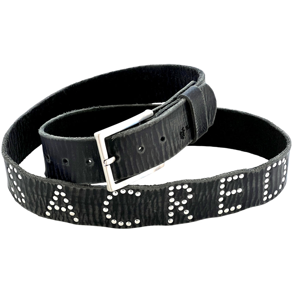 Close-up of Sacred Studded Belt with silver stud lettering on distressed black leather