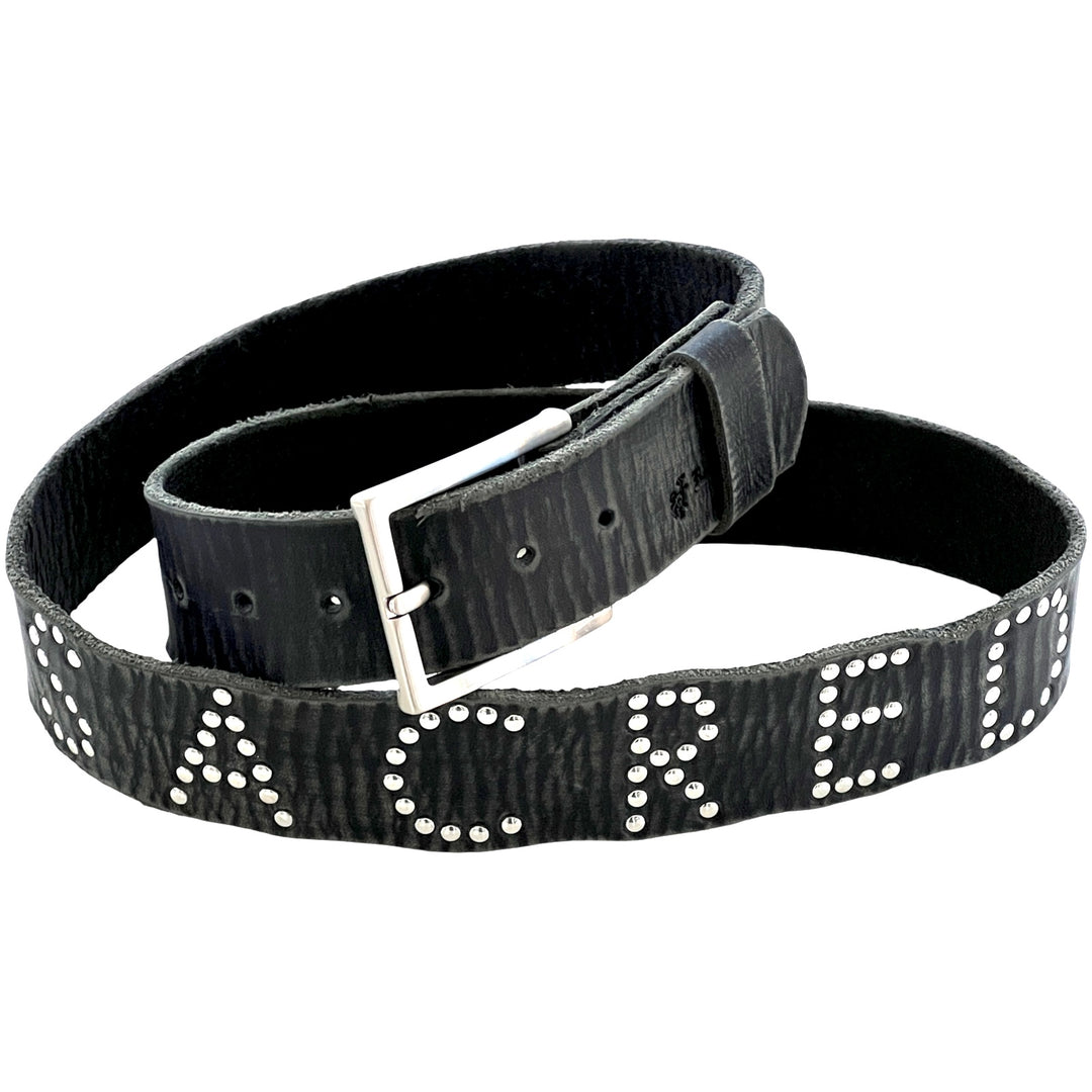 Close-up of Sacred Studded Belt with silver stud lettering on distressed black leather