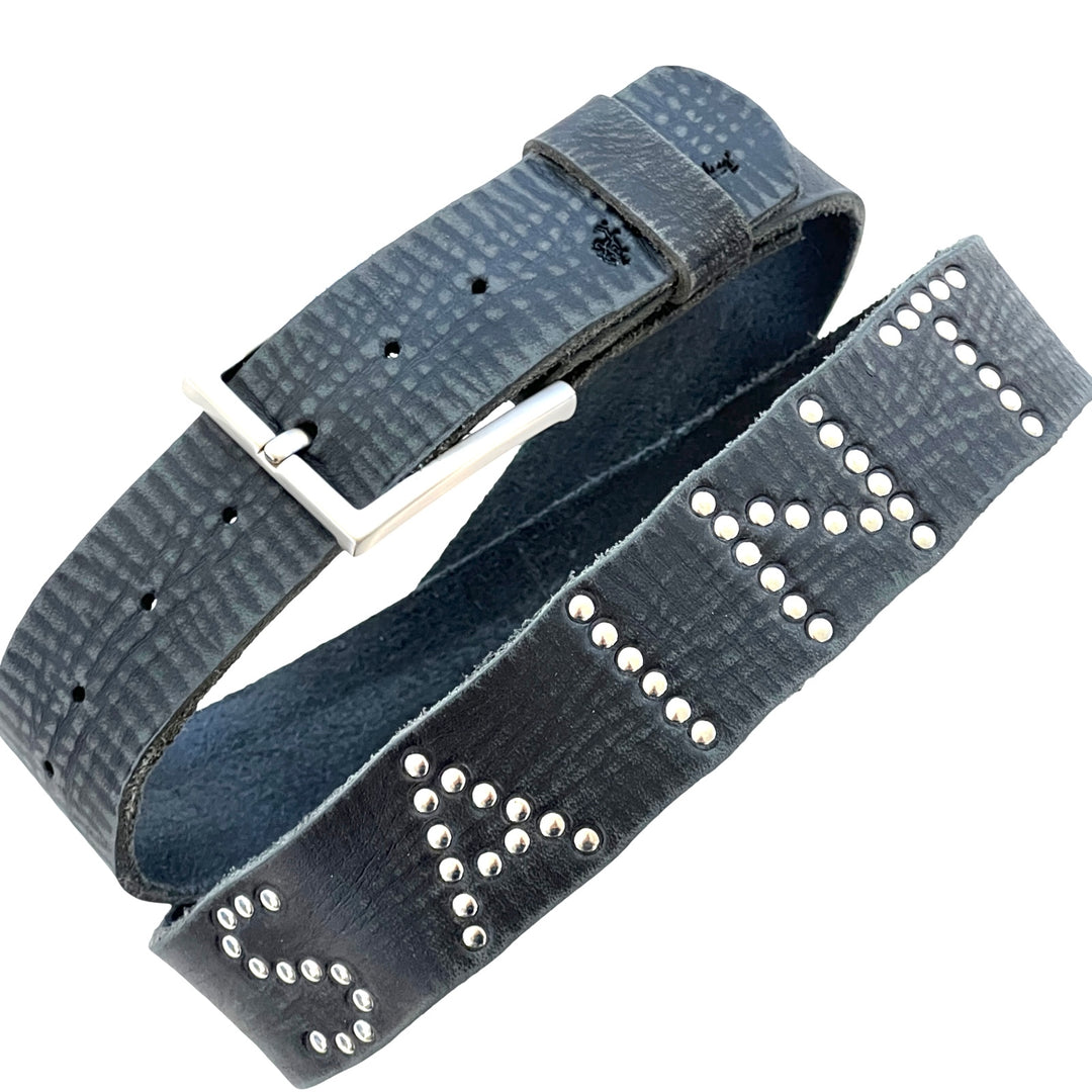 Close-up of Saint Studded Belt with silver stud lettering on distressed black leather