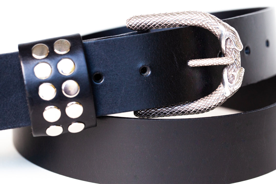 Infinity snake buckle on leather guitar strap with studded keeper