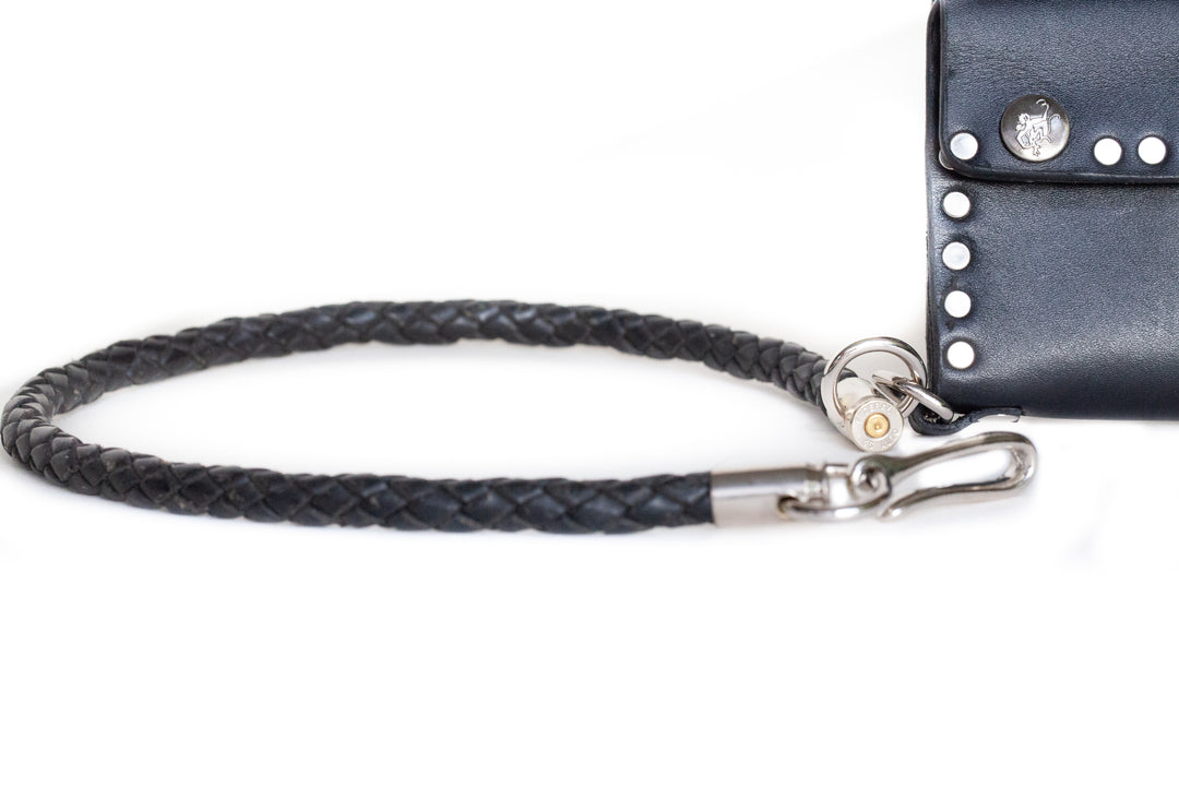Thick braided leather wallet chain with .45 caliber shell casing tips.