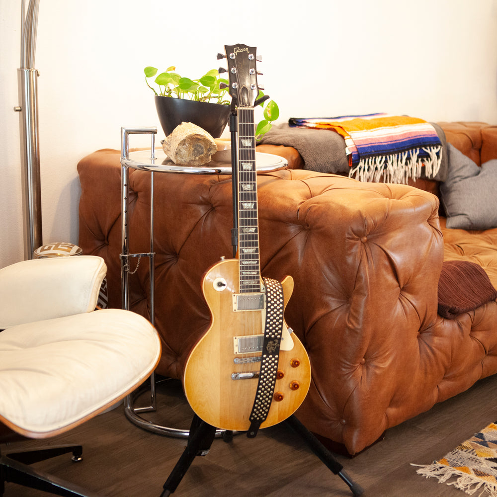 Black Bootleg studded leather guitar strap fitted to a Les Paul style guitar