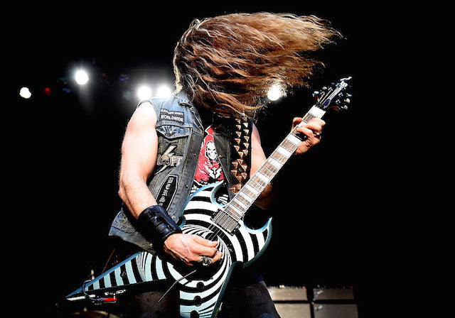 Zakky Wylde rockin' his Red Monkey pyramid leather guitar strap with his bullseye guitar